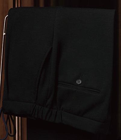 Close-up of black casual drawstring trousers with tailored detailing, designed for modern men seeking versatile, high-end fashion with sustainable appeal.