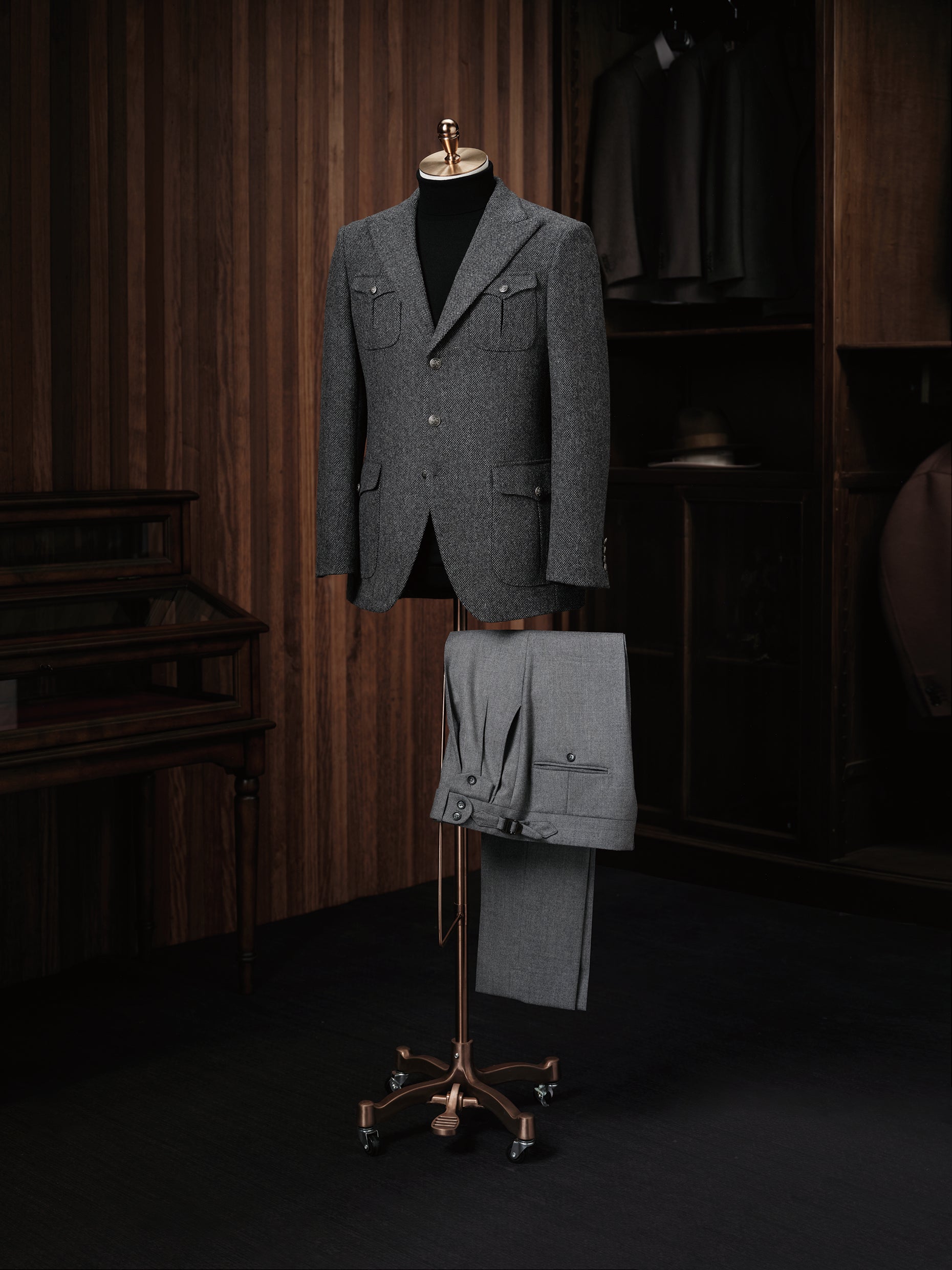A refined textured wool jacket paired with pleated trousers, ideal for a sophisticated and contemporary look.