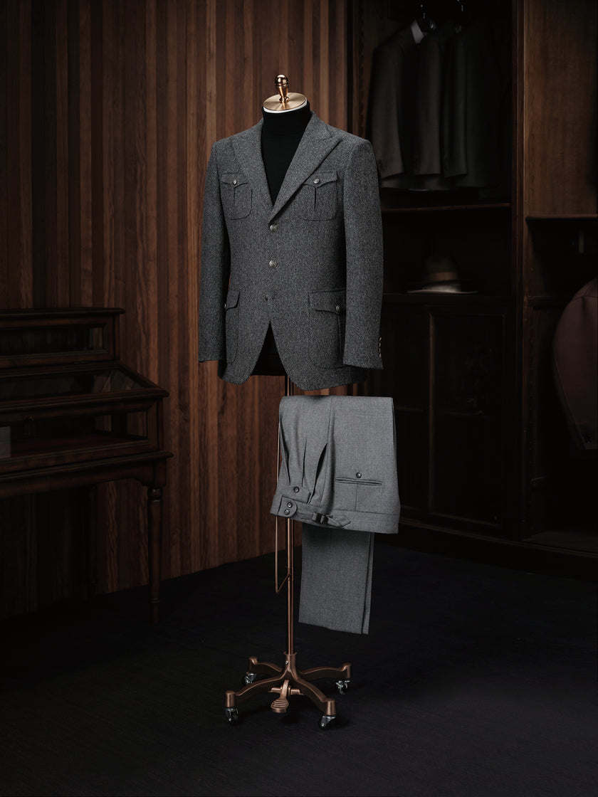 A refined textured wool jacket paired with pleated trousers, ideal for a sophisticated and contemporary look.