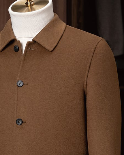 Close-up of a men's camel tailored jacket with a structured collar and classic buttons, showcasing fine craftsmanship and premium eco-friendly fabric for sustainable style.