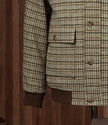 Close-up of a checked field jacket pocket and sleeve, highlighting eco-friendly tailored details and premium textured fabric, perfect for formal wear.
