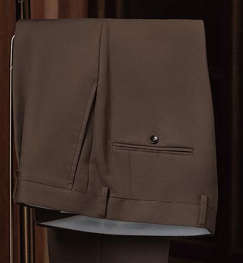 Close-up of brown khaki trousers showcasing fine tailoring, back pocket detail, and sustainable fabric, ideal for a sophisticated and eco-conscious formal look.