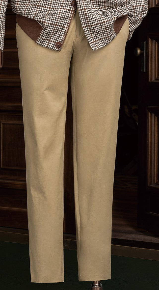 Close-up of tailored beige chinos, showcasing fine craftsmanship and sustainable fabric, perfect for a refined and eco-friendly formal ensemble.