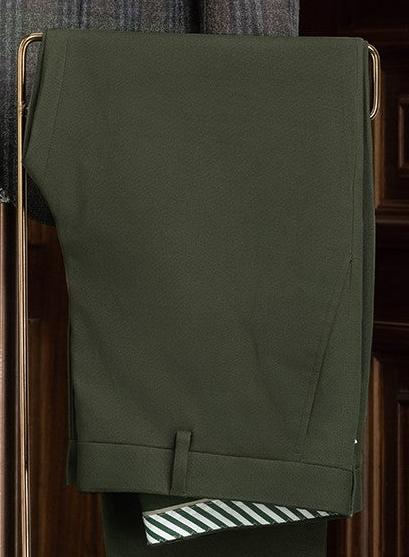 Close-up of olive tailored trousers, highlighting the elegant fabric and refined tailoring, ideal for pairing with high-end jackets for formal occasions.