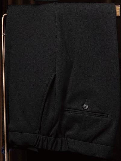 Close-up of black tailored trousers, showcasing premium fabric and precise detailing, perfect for formal, eco-conscious fashion.