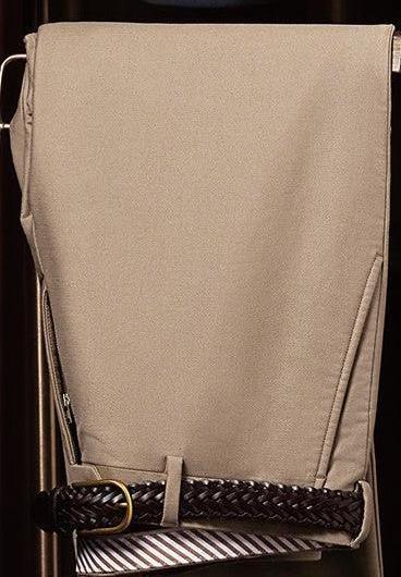 Close-up of beige tailored trousers with a stylish belt. Made from sustainable materials, ideal for a refined formal attire look.