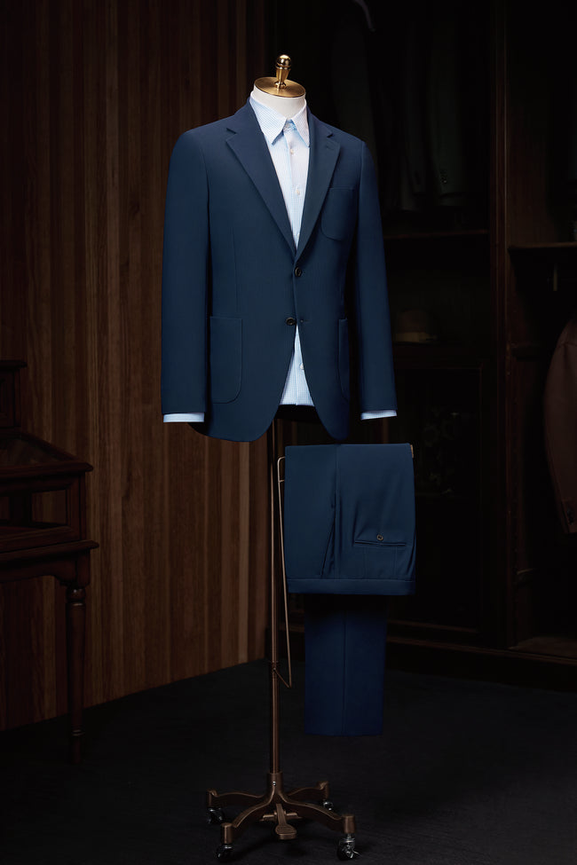 Classic two-button navy suit tailored for a sharp, sophisticated look. Perfect for formal events, this suit offers a high-end feel and eco-friendly craftsmanship. Ideal for women who appreciate luxury tailoring with sustainable materials.