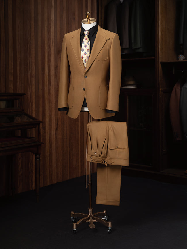 Luxurious dark beige tailored suit, designed for a high-end look at formal events. Crafted with eco-friendly, sustainable materials, this stylish men's outfit combines sophistication and comfort, perfect for refined fashion enthusiasts.